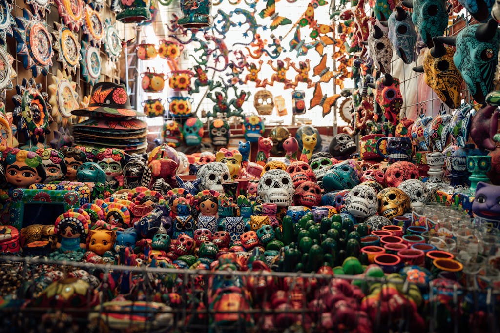 Colorful ceramic skulls and crafts at a market in Ciudad de México, showcasing Mexican culture.